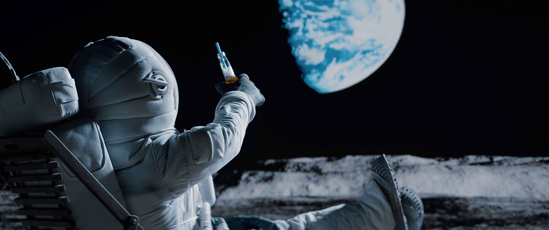 Astronaut holding a beer on the moon